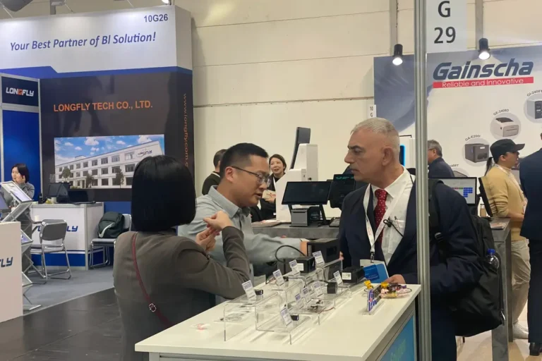 X-dynamics team presenting 3D vision cameras at an exhibition in Germany